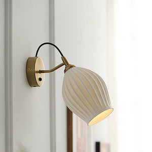 Celestia Pleated Ceramic Wall Sconce with a pleated ceramic lampshade and Chrome or Brass base, ideal for adding a touch of sophistication to any room.