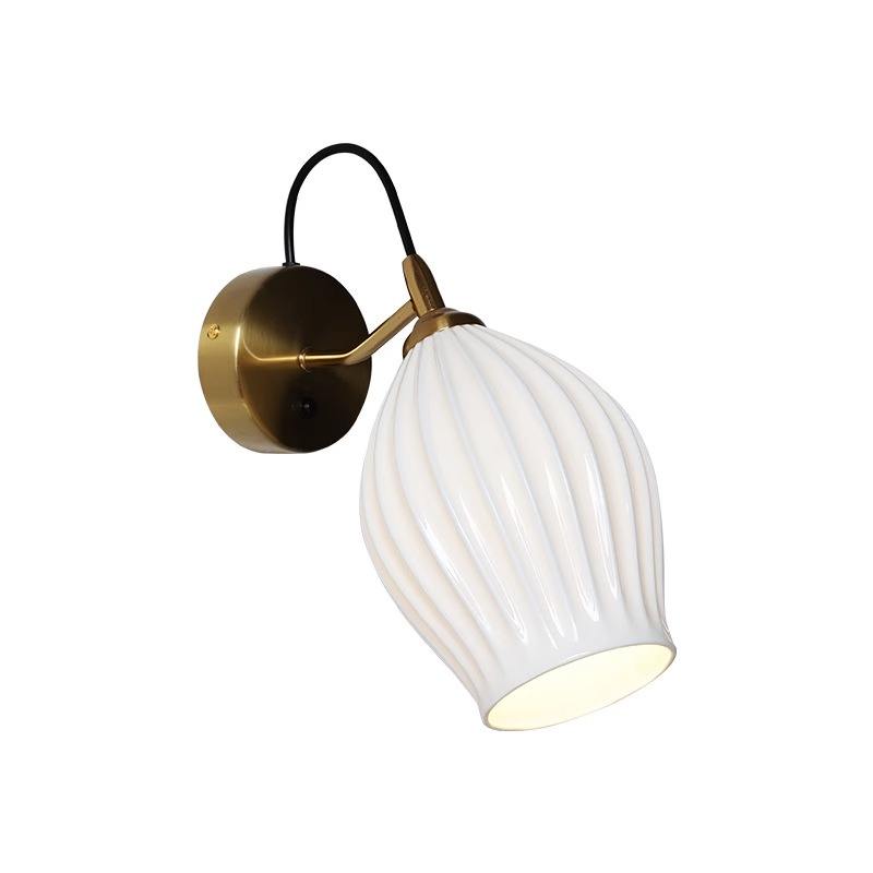 Celestia Pleated Ceramic Wall Sconce with a pleated ceramic lampshade and Chrome or Brass base, ideal for adding a touch of sophistication to any room.