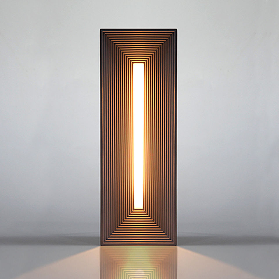 Infinite Illusion LED Lamp on a wooden table, glowing with its mesmerizing celestial illusion.