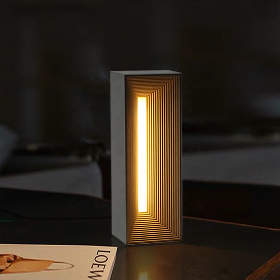 Infinite Illusion LED Lamp on a wooden table, glowing with its mesmerizing celestial illusion.