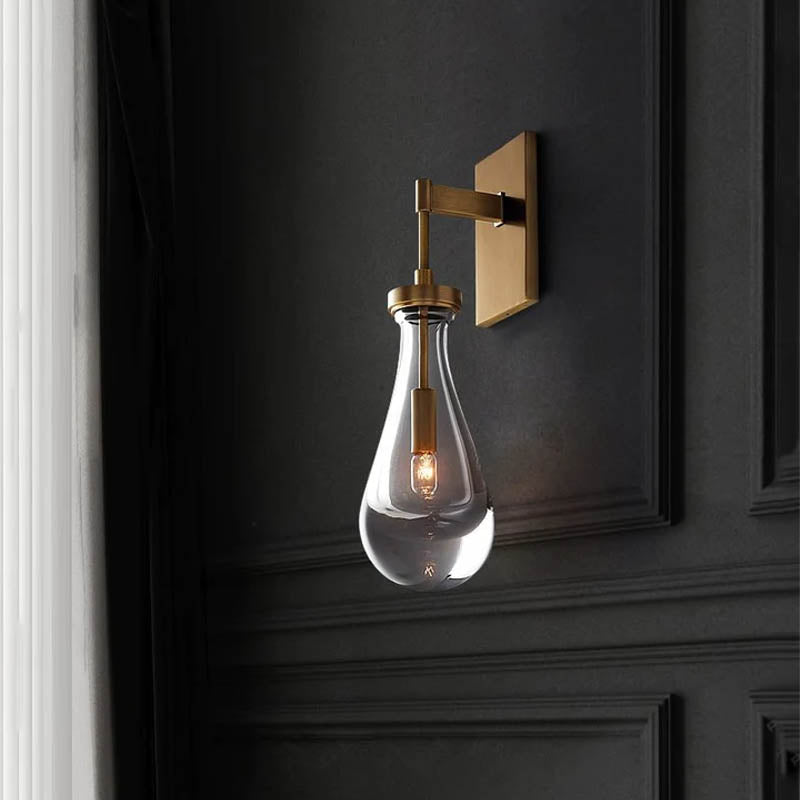 Raindrop Crystal Wall Light featuring premium brass and crystal, casting enchanting ripples of light.