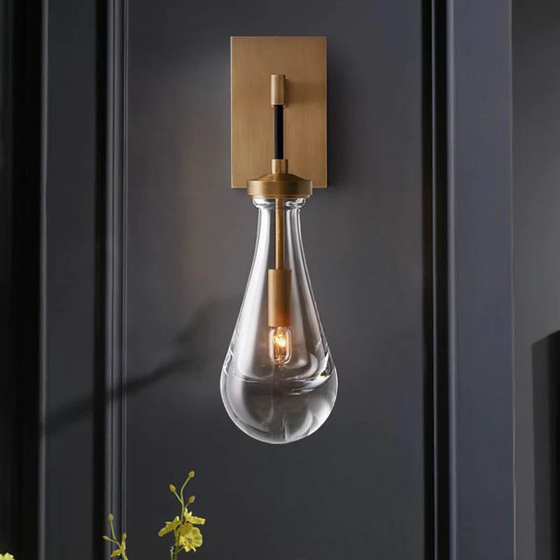 Raindrop Crystal Wall Light featuring premium brass and crystal, casting enchanting ripples of light.