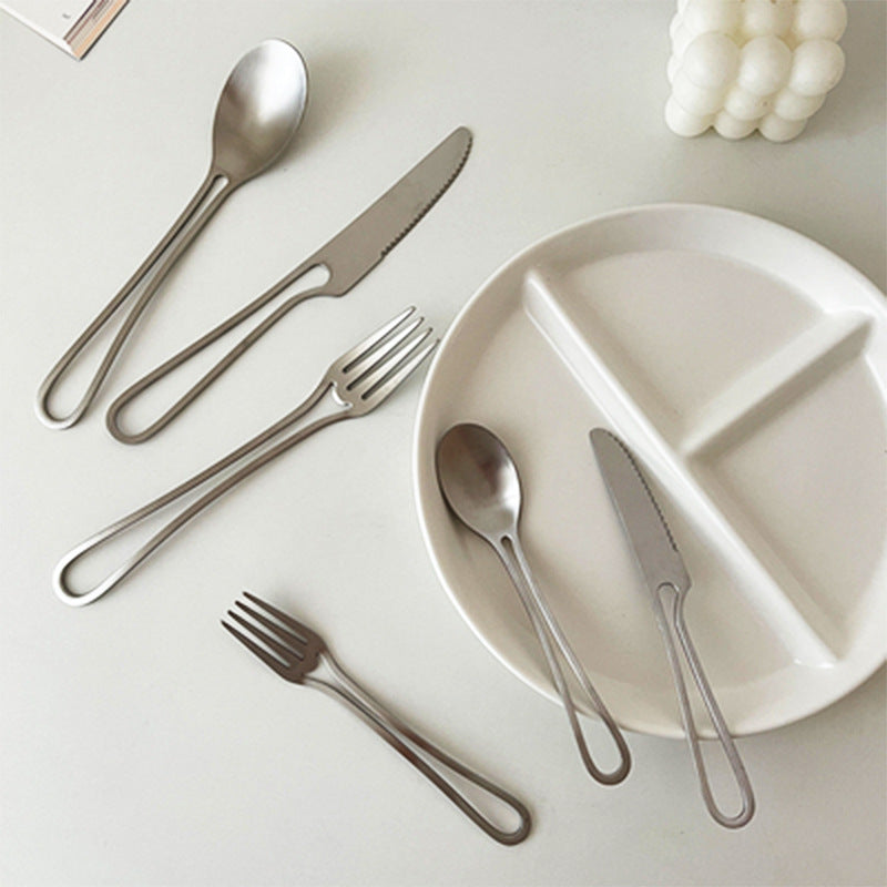 Elegant Svelte Void Cutlery Collection featuring minimalist design with hollow handles