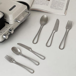 Elegant Svelte Void Cutlery Collection featuring minimalist design with hollow handles