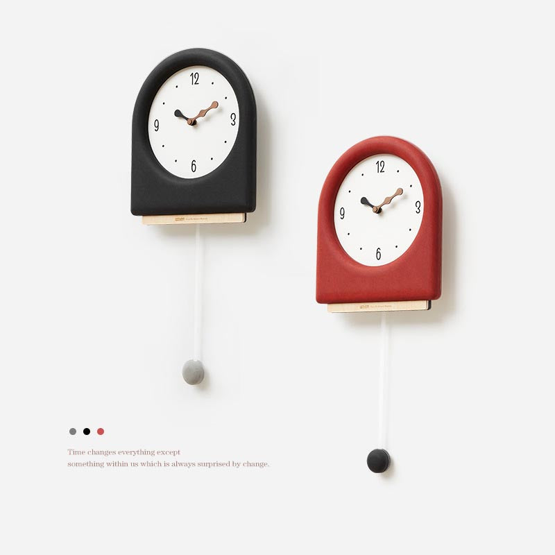 Time's Arc Pendulum Clock showcasing an elegant, minimalist design with a unique arched top and silent movement.