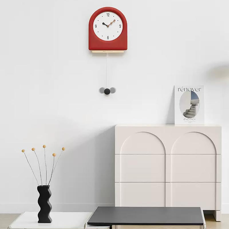 Time's Arc Pendulum Clock showcasing an elegant, minimalist design with a unique arched top and silent movement.