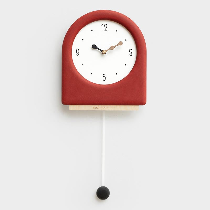 Time&#39;s Arc Pendulum Clock showcasing an elegant, minimalist design with a unique arched top and silent movement.