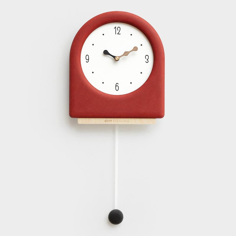Time's Arc Pendulum Clock showcasing an elegant, minimalist design with a unique arched top and silent movement.