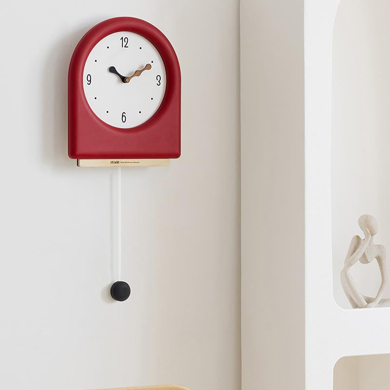 Time's Arc Pendulum Clock showcasing an elegant, minimalist design with a unique arched top and silent movement.