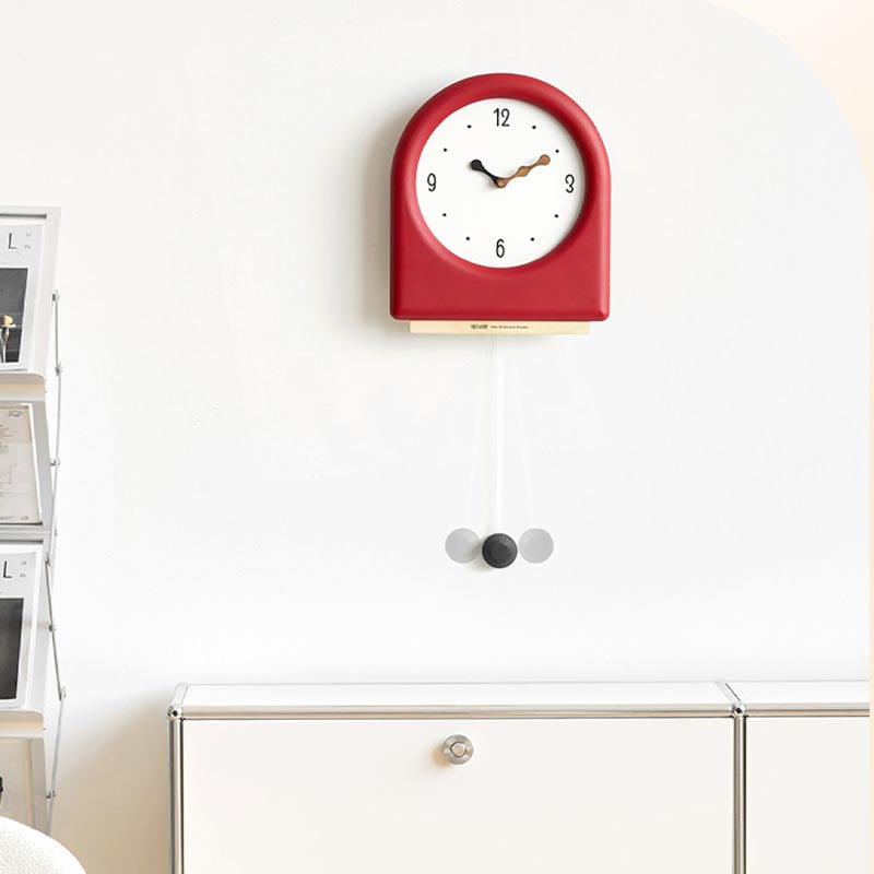 Time's Arc Pendulum Clock showcasing an elegant, minimalist design with a unique arched top and silent movement.