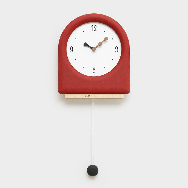 Time's Arc Pendulum Clock showcasing an elegant, minimalist design with a unique arched top and silent movement.