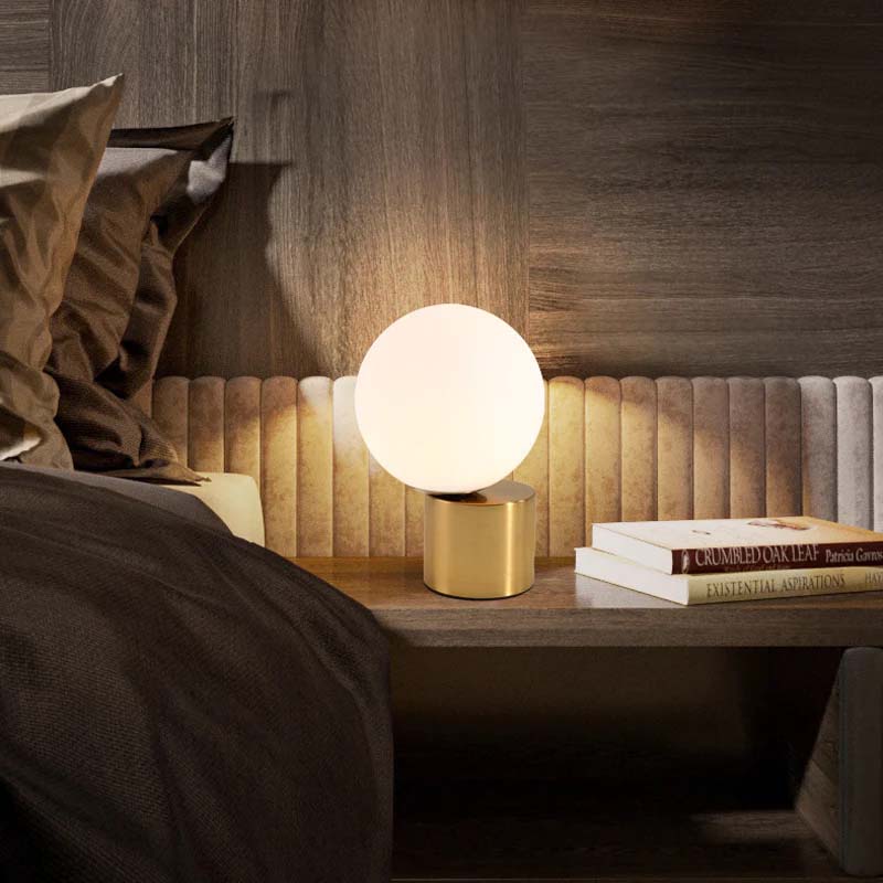 Illuminare Table Lamp showcasing its elegant design and gold-plated base on LuxusHeim.