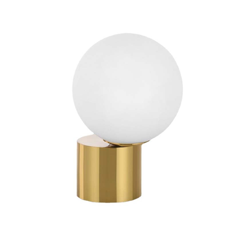 Illuminare Table Lamp showcasing its elegant design and gold-plated base on LuxusHeim.