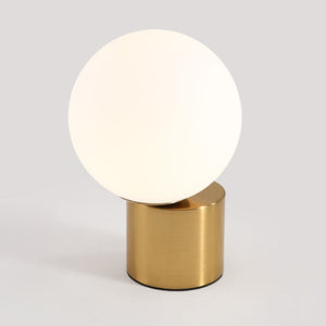 Illuminare Table Lamp showcasing its elegant design and gold-plated base on LuxusHeim.