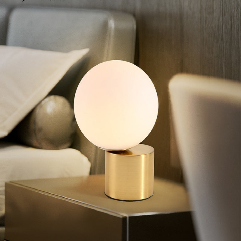 Illuminare Table Lamp showcasing its elegant design and gold-plated base on LuxusHeim.