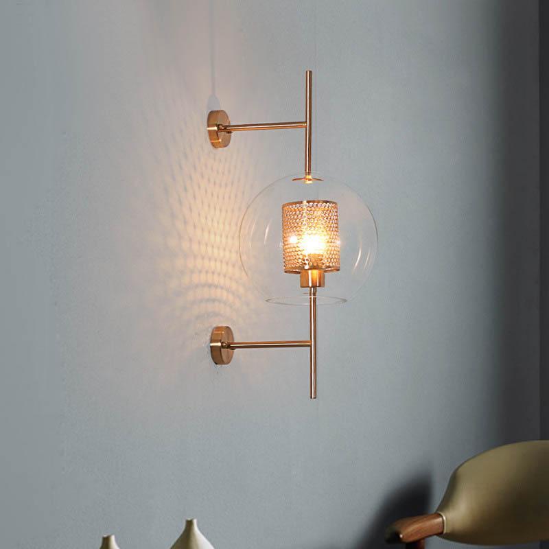 Honeycomb Radiance Orb Sconce elegantly illuminating a cozy living room corner with its soft, golden glow.