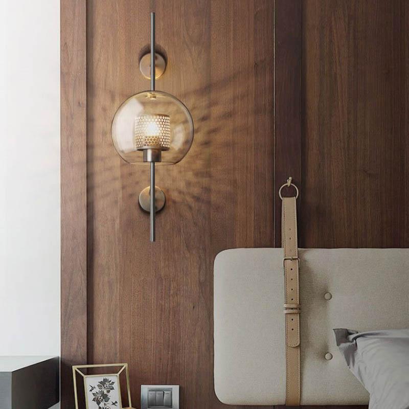 Honeycomb Radiance Orb Sconce elegantly illuminating a cozy living room corner with its soft, golden glow.