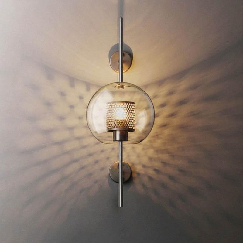 Honeycomb Radiance Orb Sconce elegantly illuminating a cozy living room corner with its soft, golden glow.