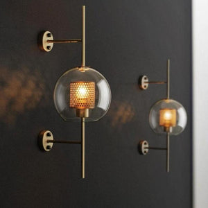 Honeycomb Radiance Orb Sconce elegantly illuminating a cozy living room corner with its soft, golden glow.