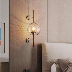 Honeycomb Radiance Orb Sconce elegantly illuminating a cozy living room corner with its soft, golden glow.