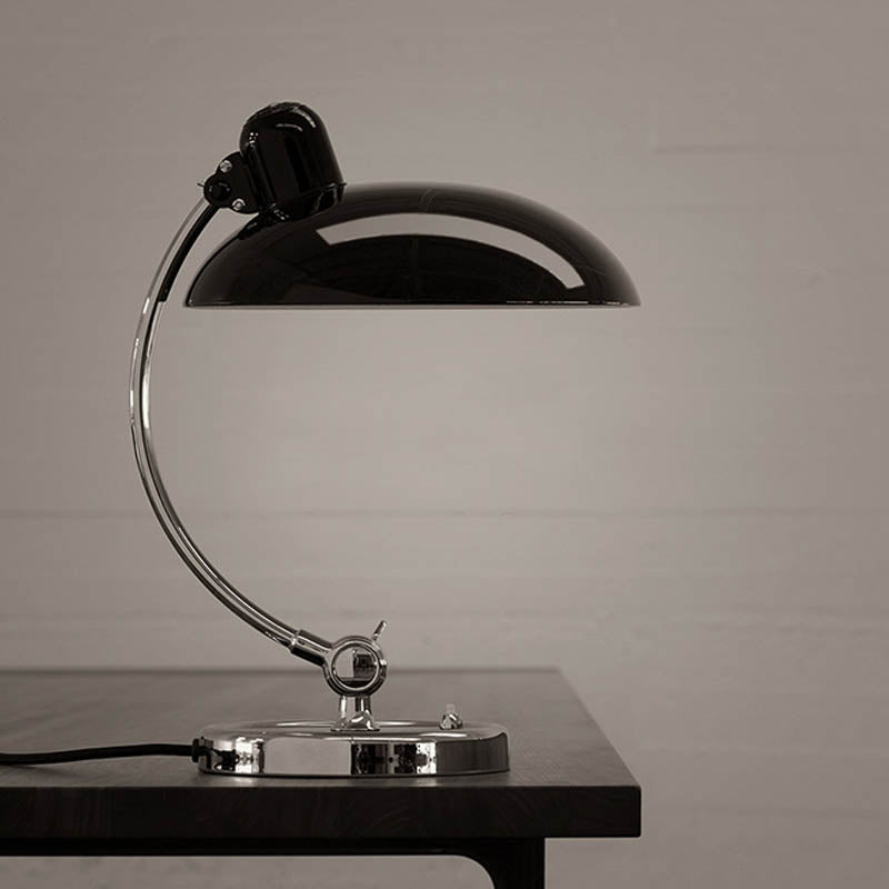 Brano Desk Lamp showcasing its sleek design and elegant finish on LuxusHeim.