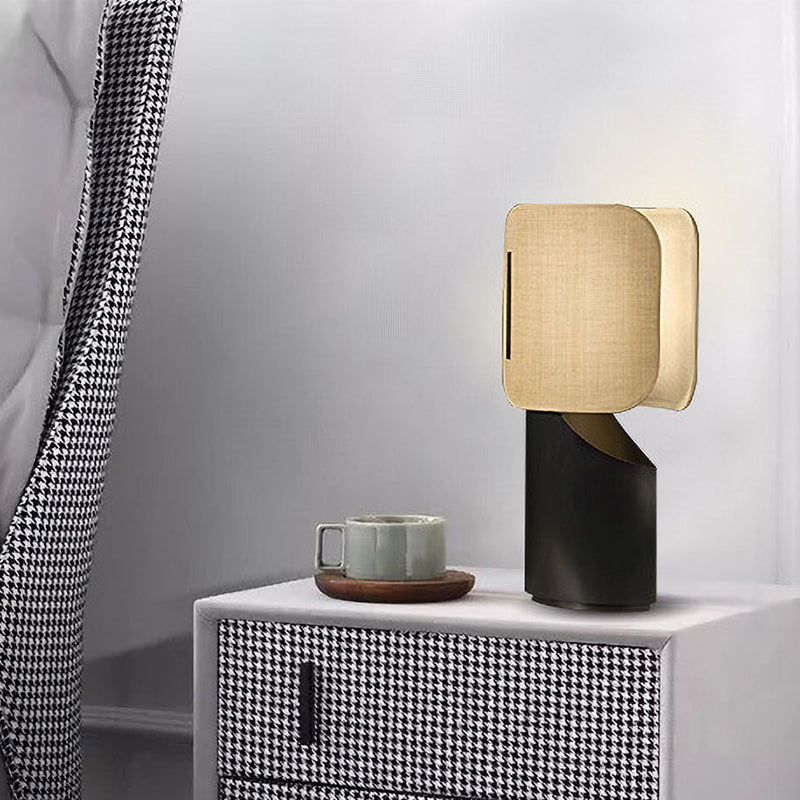 Apixa Table Lamp showcasing a sleek black finish and modern design on LuxusHeim