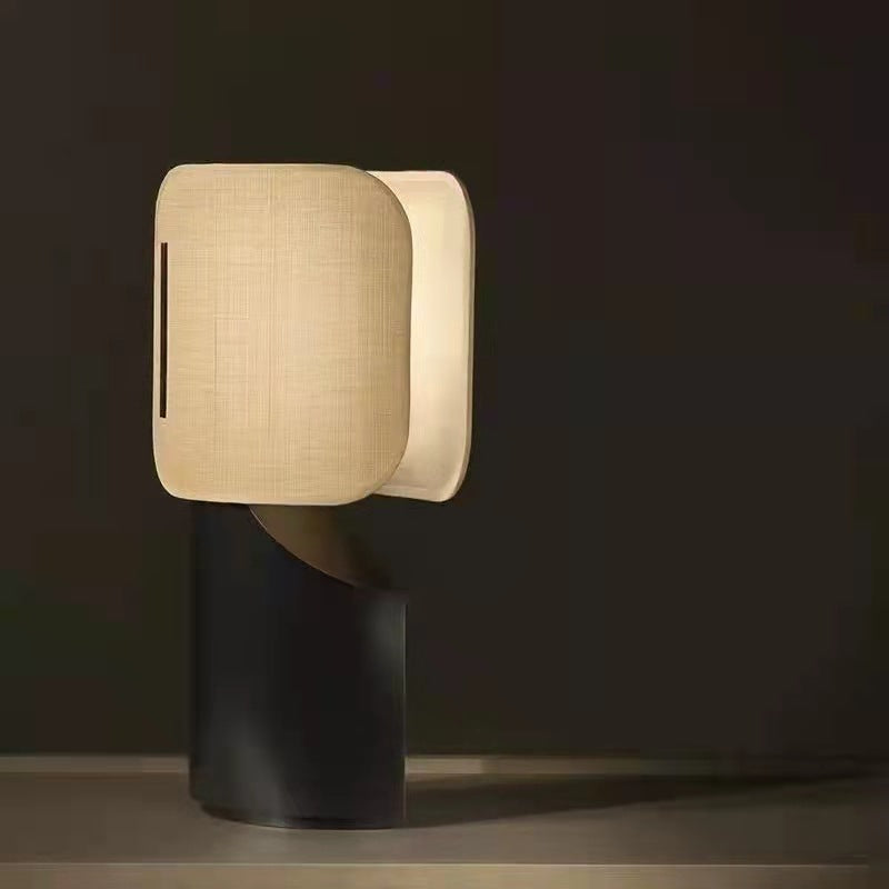 Apixa Table Lamp showcasing a sleek black finish and modern design on LuxusHeim