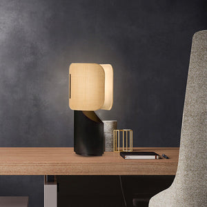 Apixa Table Lamp showcasing a sleek black finish and modern design on LuxusHeim