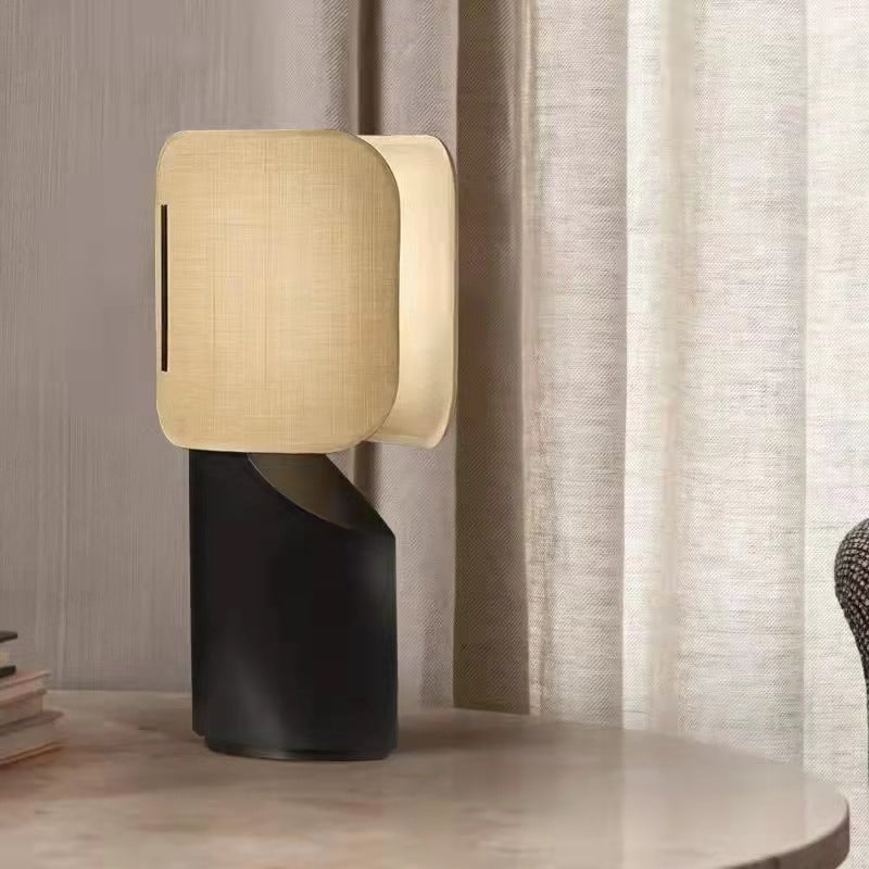 Apixa Table Lamp showcasing a sleek black finish and modern design on LuxusHeim