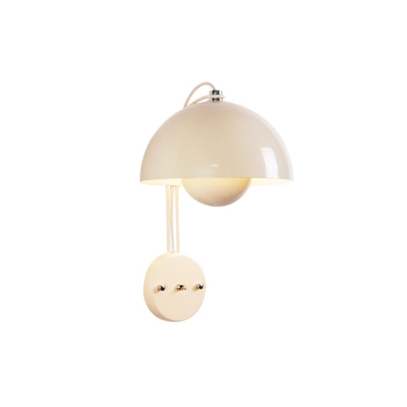 Blooming Grace Wall Lamp casting a warm glow in a stylish living room, highlighting its unique flower bud-inspired design and premium materials.