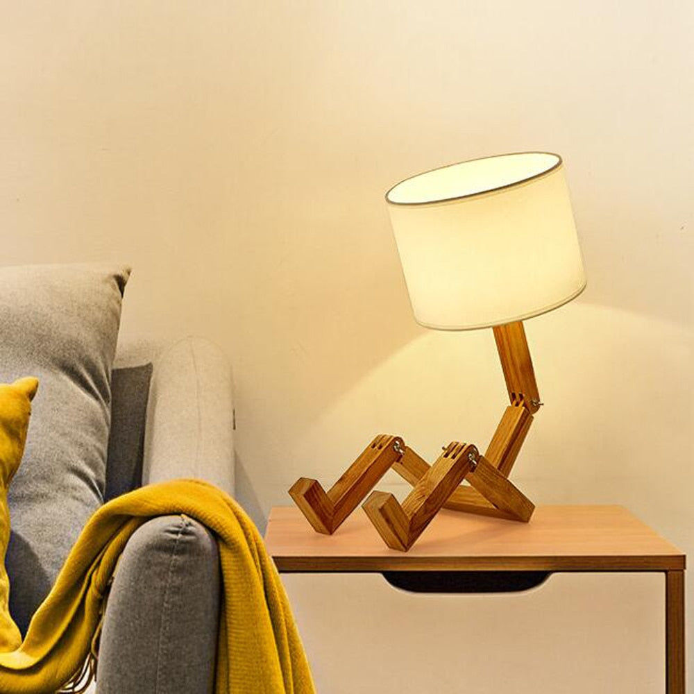 Humanoid Versatile Desk Lamp showcasing its unique design and flexible joints on LuxusHeim.