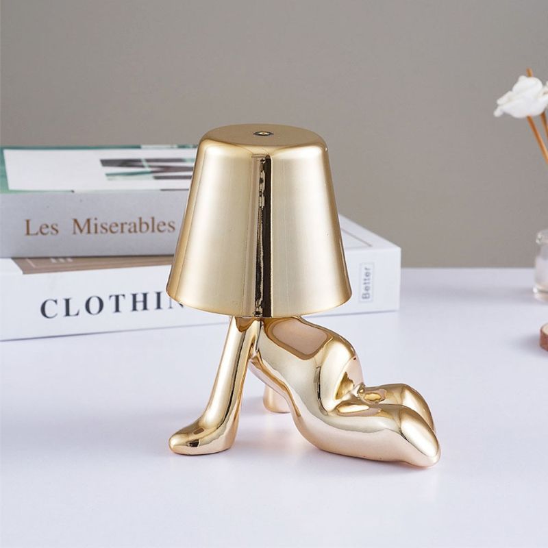 Golden Brothers Portable Table Lamp with a classic gold finish on LuxusHeim