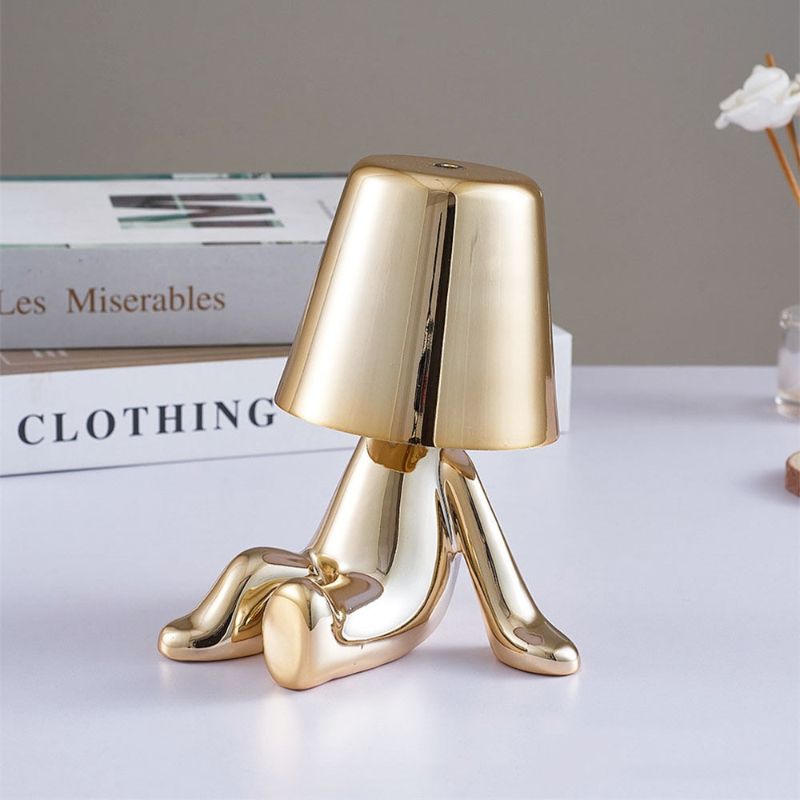 Golden Brothers Portable Table Lamp with a classic gold finish on LuxusHeim