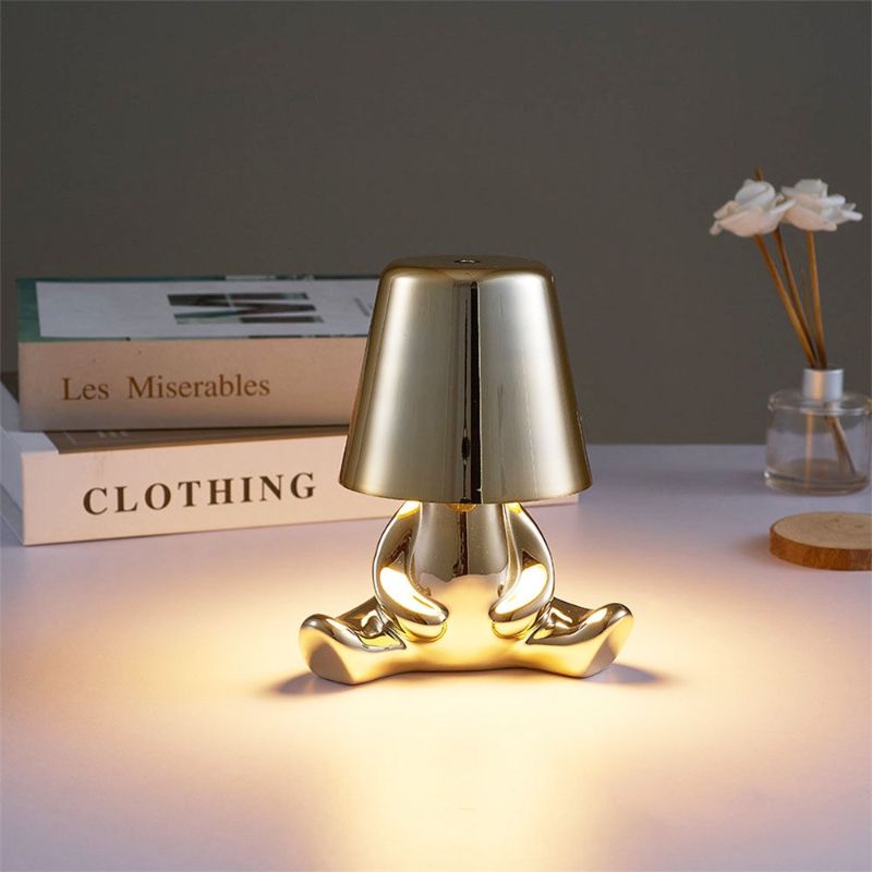 Golden Brothers Portable Table Lamp with a classic gold finish on LuxusHeim