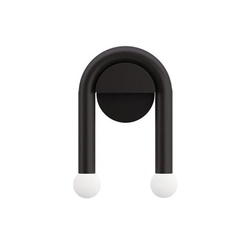 ArchLite Dual-Glow Wall Sconce elegantly lighting up a modern living room, showcasing its unique arched design.