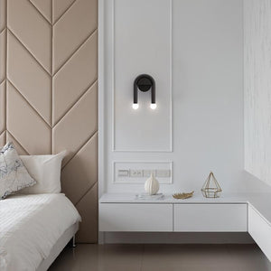 ArchLite Dual-Glow Wall Sconce elegantly lighting up a modern living room, showcasing its unique arched design.