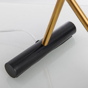 Clio Table Lamp showcasing its modern design and elegant finish on LuxusHeim.