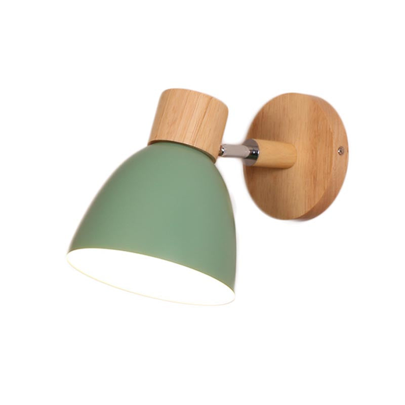 Vibrant Rotating Sconce in a cozy bedroom setting, showcasing its colorful finish.