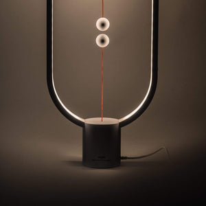 Heng Balance Desk Lamp showcasing its unique balance mechanism and sleek design on LuxusHeim.