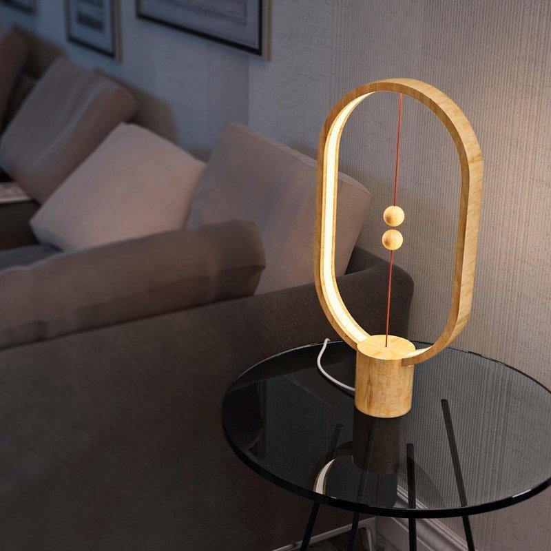 Heng Balance Desk Lamp showcasing its unique balance mechanism and sleek design on LuxusHeim.