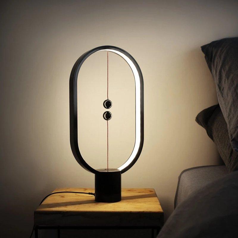 Heng Balance Desk Lamp showcasing its unique balance mechanism and sleek design on LuxusHeim.