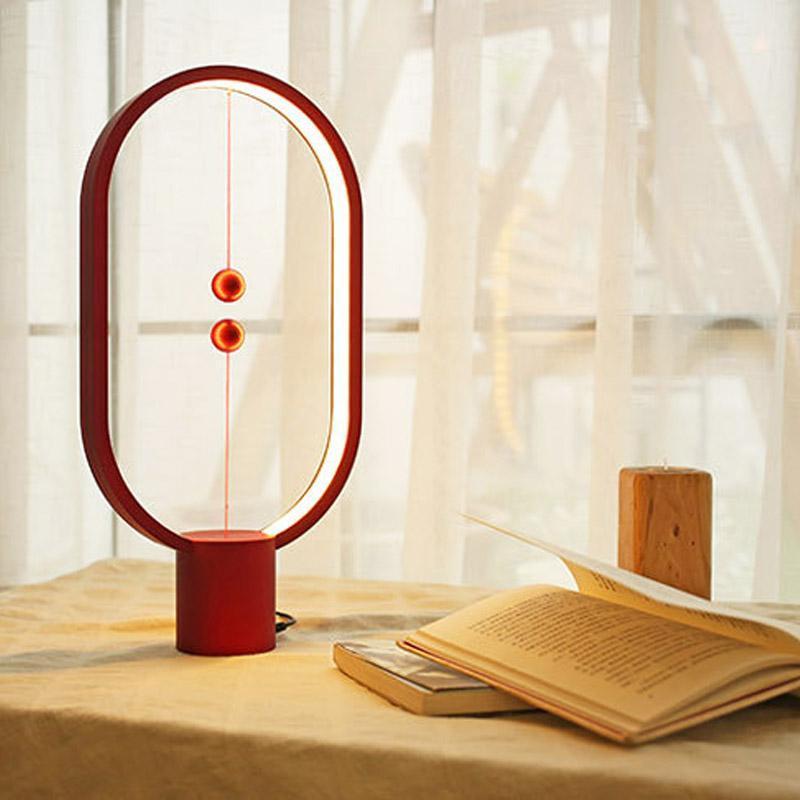 Heng Balance Desk Lamp showcasing its unique balance mechanism and sleek design on LuxusHeim.