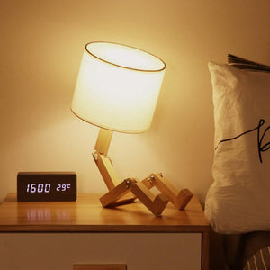 Humanoid Versatile Desk Lamp showcasing its unique design and flexible joints on LuxusHeim.