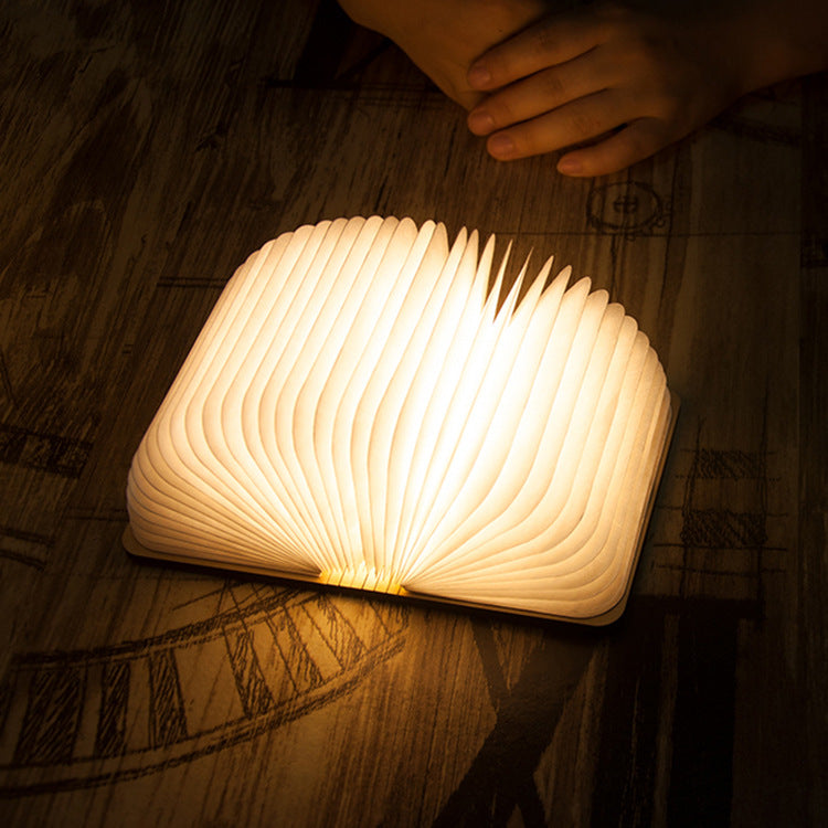 Luminous Folding Book Night Light opened to showcase its magical glow on LuxusHeim.