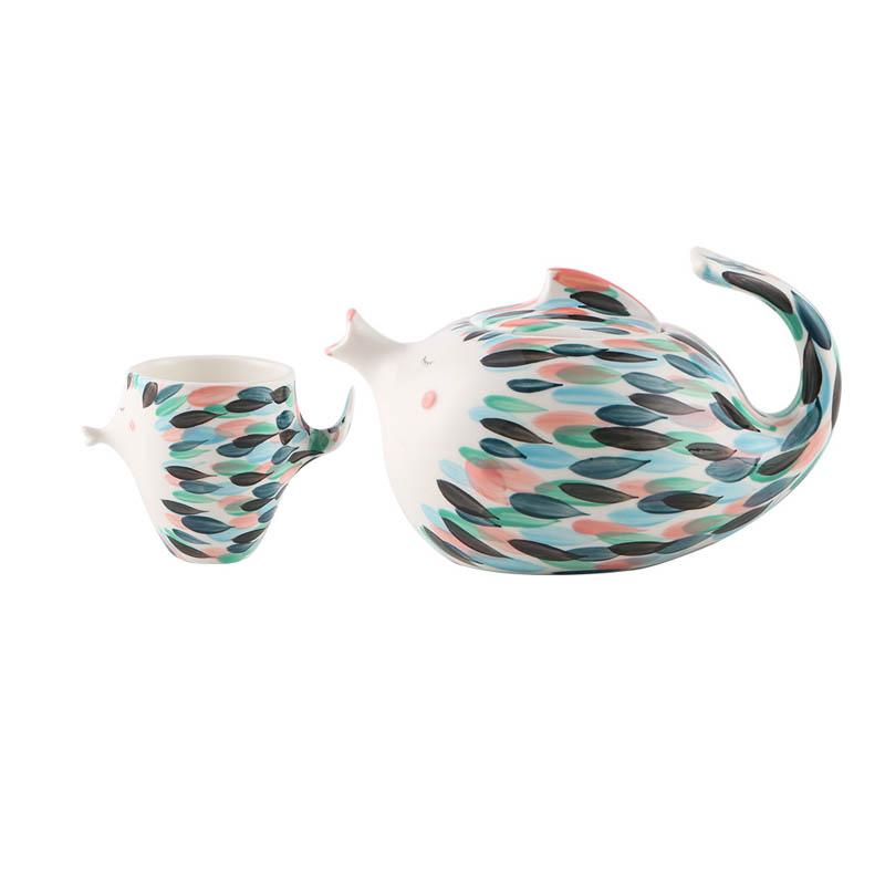 Kissy Fish Tea Set displayed on a dining table with tea and plates