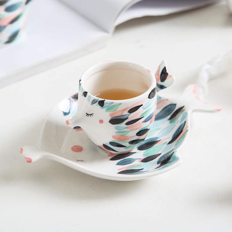 Kissy Fish Tea Set displayed on a dining table with tea and plates