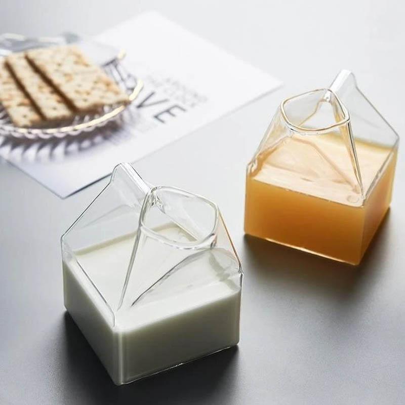 Premium Transparent Glass Milk Carton on a table with beverages