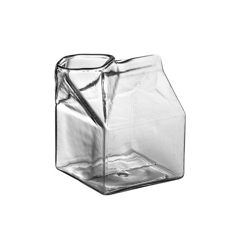 Premium Transparent Glass Milk Carton on a table with beverages