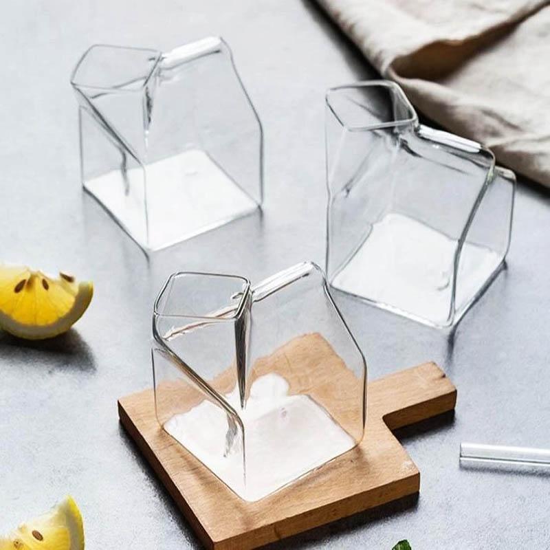 Premium Transparent Glass Milk Carton on a table with beverages