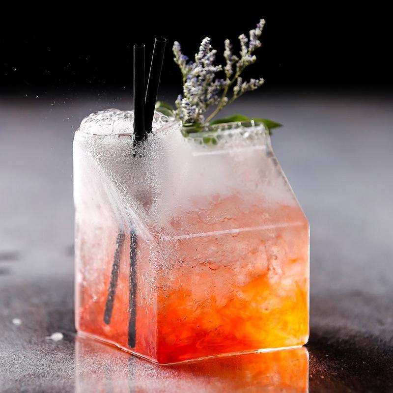 Premium Transparent Glass Milk Carton on a table with beverages